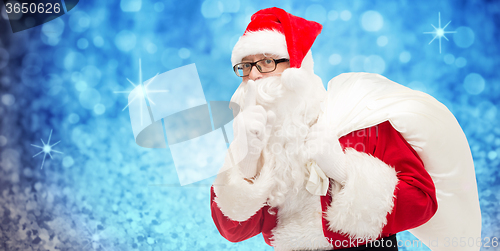 Image of man in costume of santa claus with bag