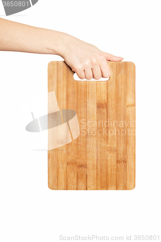Image of hand holding chopping board