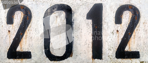 Image of Rusty metal plate with numbers 