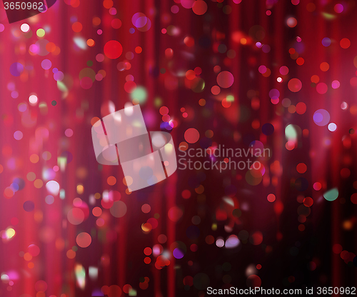 Image of confetti against a blurred curtain background