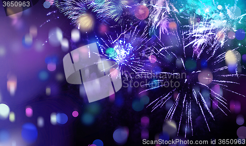 Image of bright sparkling multicolor fireworks and confetti