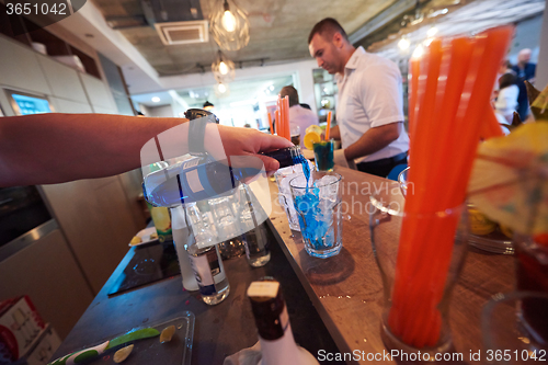 Image of barman prepare fresh coctail drink