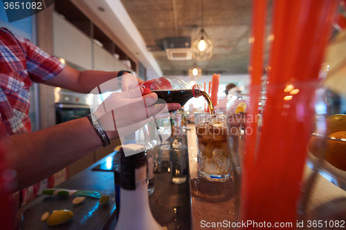 Image of barman prepare fresh coctail drink