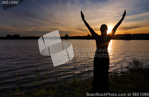 Image of Rejoice Life - woman  against sunset sky