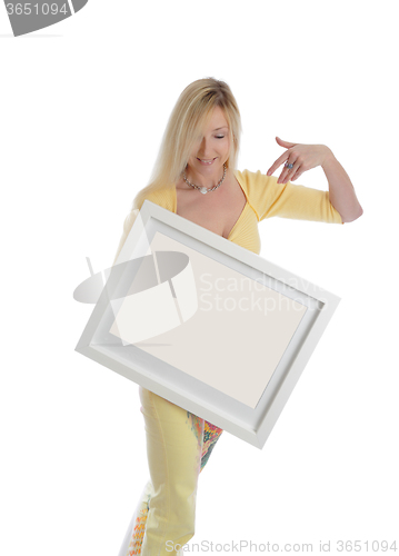 Image of Smiling woman holding a picture painting sign message