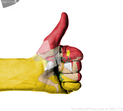 Image of Closeup of male hand showing thumbs up sign