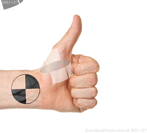 Image of Closeup of male hand showing thumbs up sign