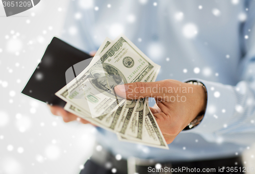 Image of close up of businessman hands holding money