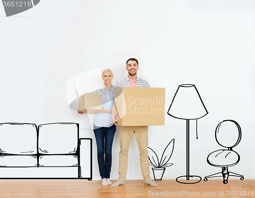 Image of couple with cardboard boxes moving to new home