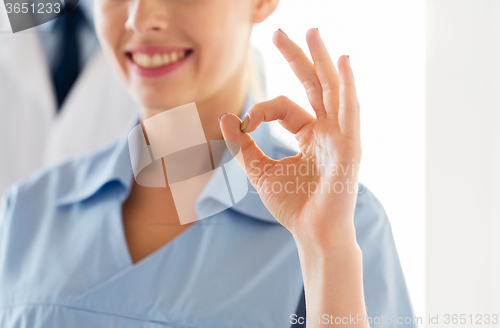 Image of close up of doctor or nurse showing ok sign