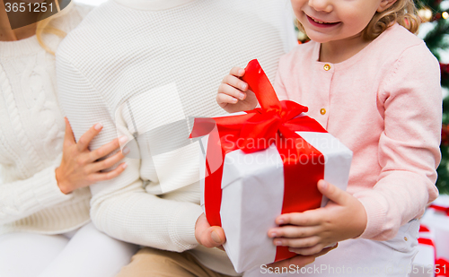 Image of close up of mother and child girl with gift box