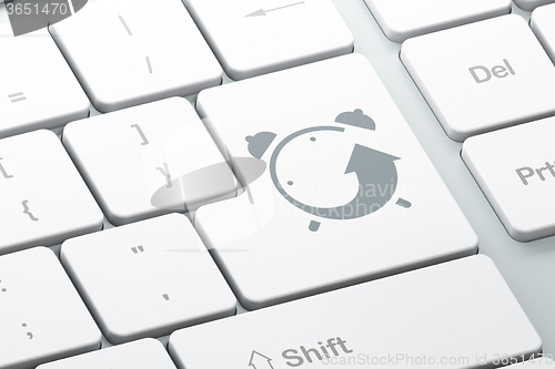 Image of Time concept: Alarm Clock on computer keyboard background