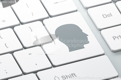 Image of Advertising concept: Head on computer keyboard background