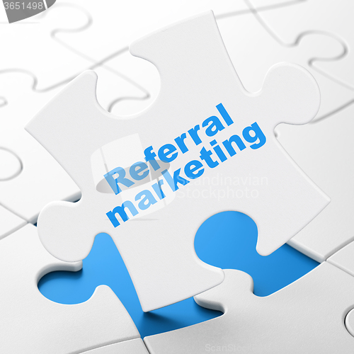 Image of Advertising concept: Referral Marketing on puzzle background