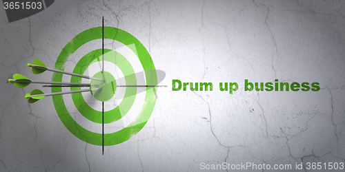 Image of Finance concept: target and Drum up business on wall background