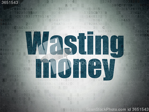 Image of Currency concept: Wasting Money on Digital Paper background