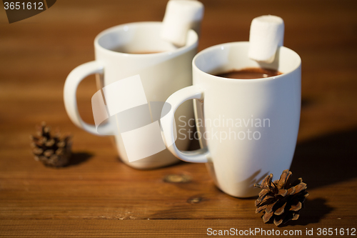 Image of cups of hot chocolate with marshmallow on wood