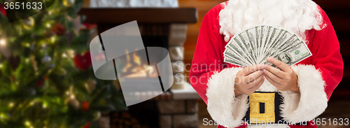 Image of close up of santa claus with dollar money