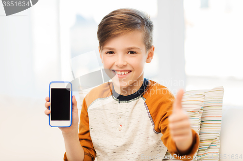 Image of smiling boy with smartphone at home