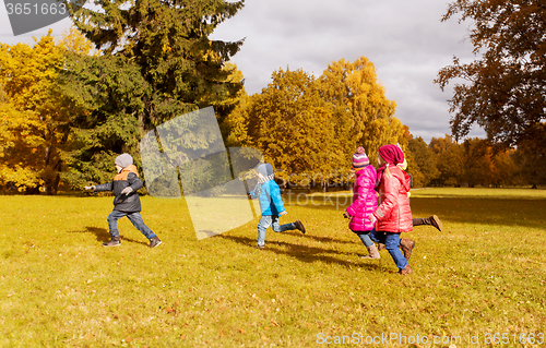 Image of group of happy little kids running outdoors