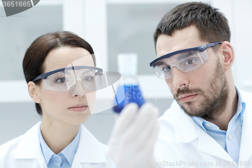 Image of young scientists making test or research in lab