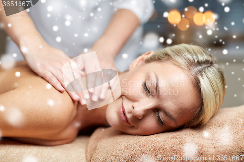 Image of close up of woman having back massage in spa