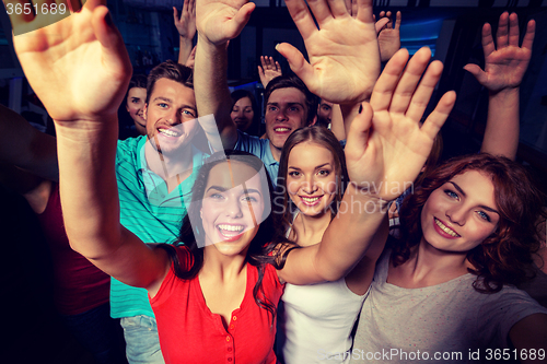 Image of smiling women dancing in club