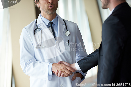 Image of doctor handshake with a patient