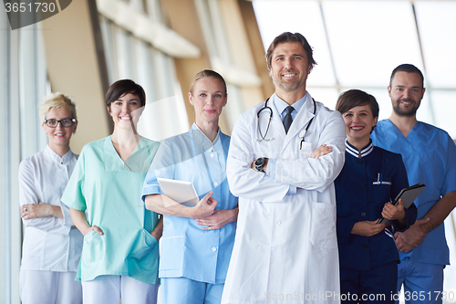 Image of group of medical staff at hospital, handsome doctor in front of 