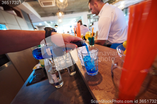 Image of barman prepare fresh coctail drink