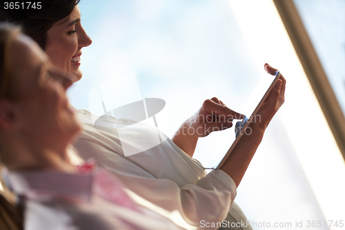 Image of business woman working on tablet computer
