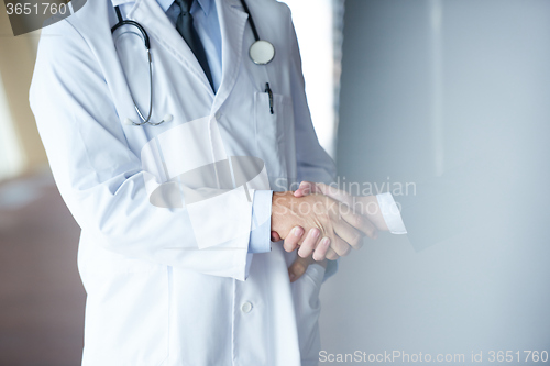 Image of doctor handshake with a patient