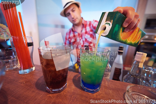 Image of barman prepare fresh coctail drink