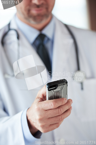 Image of doctor speaking on cellphone