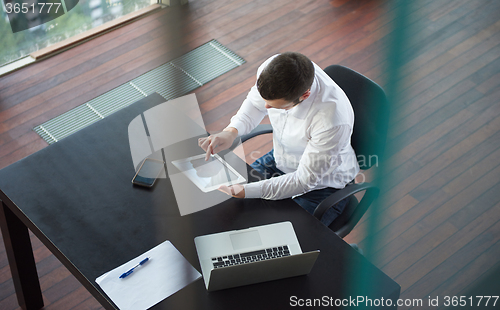 Image of top view of young business man at office