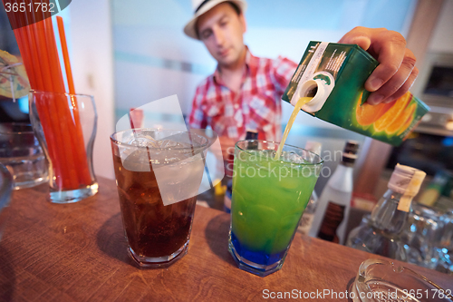 Image of barman prepare fresh coctail drink