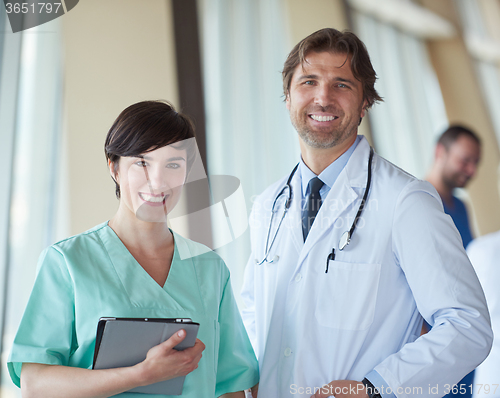 Image of group of medical staff at hospital, handsome doctor in front of 