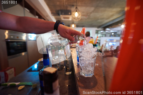 Image of barman prepare fresh coctail drink