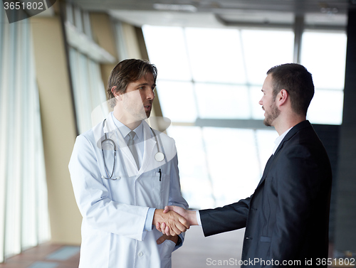 Image of doctor handshake with a patient