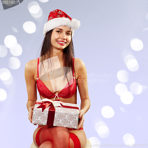 Image of Santa-girl with present