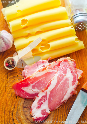 Image of Bacon with cheese on the wooden board