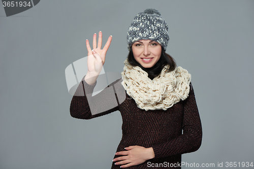 Image of Woman giving high five gesture