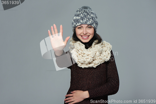 Image of Woman giving high five gesture