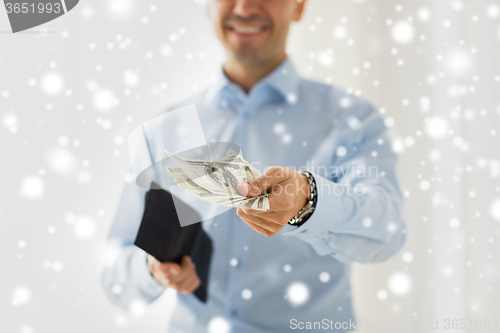 Image of close up of businessman hands holding money