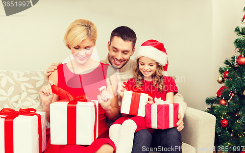 Image of happy family opening gift boxes