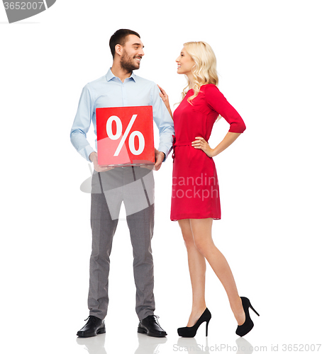 Image of happy couple with red sale sign