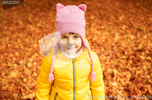 Image of happy little girl in autumn park