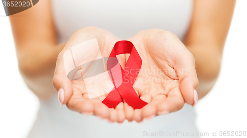 Image of hands holding red AIDS awareness ribbon