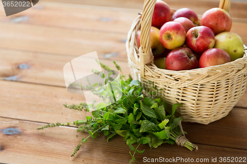 Image of close up of melissa and basket with apples