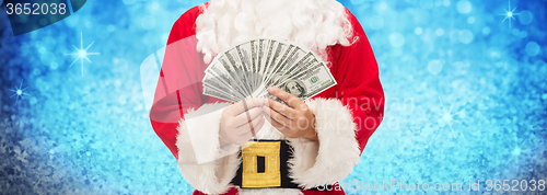 Image of close up of santa claus with dollar money